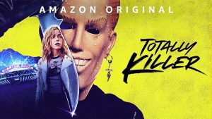 Amazon Original, 'Totally Killer' A mash-up photo of main star, Jamie Hughes, the masked Sweet Sixteen Killer,a large bladed weapon, and the Quantum Drop fair ride from the fun fair.