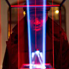 Assane Diop staring through the laser preotective shield at the invaluable black pearl.