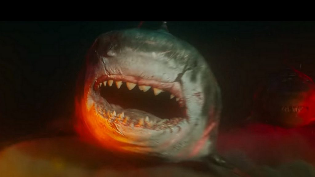 Close image. The Meg. Dark background, dark ocean photo, beneath the trench. Front face image: eye and open jaws.